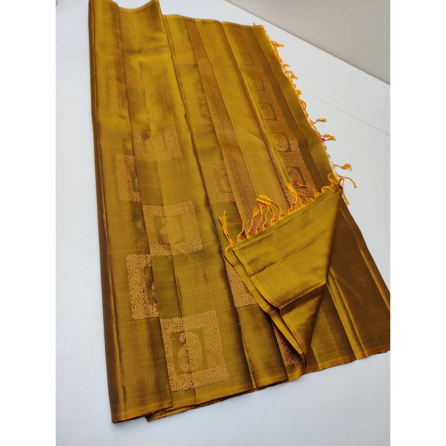 Kanjivaram silk saree in golden color borderless