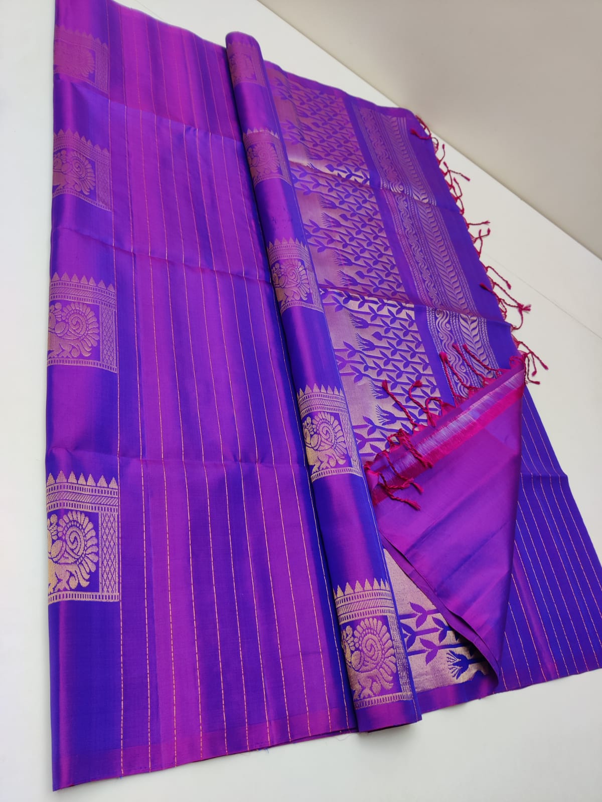 Pure Kanjivaram silk saree in purple color with woven geometric sequence with peacock