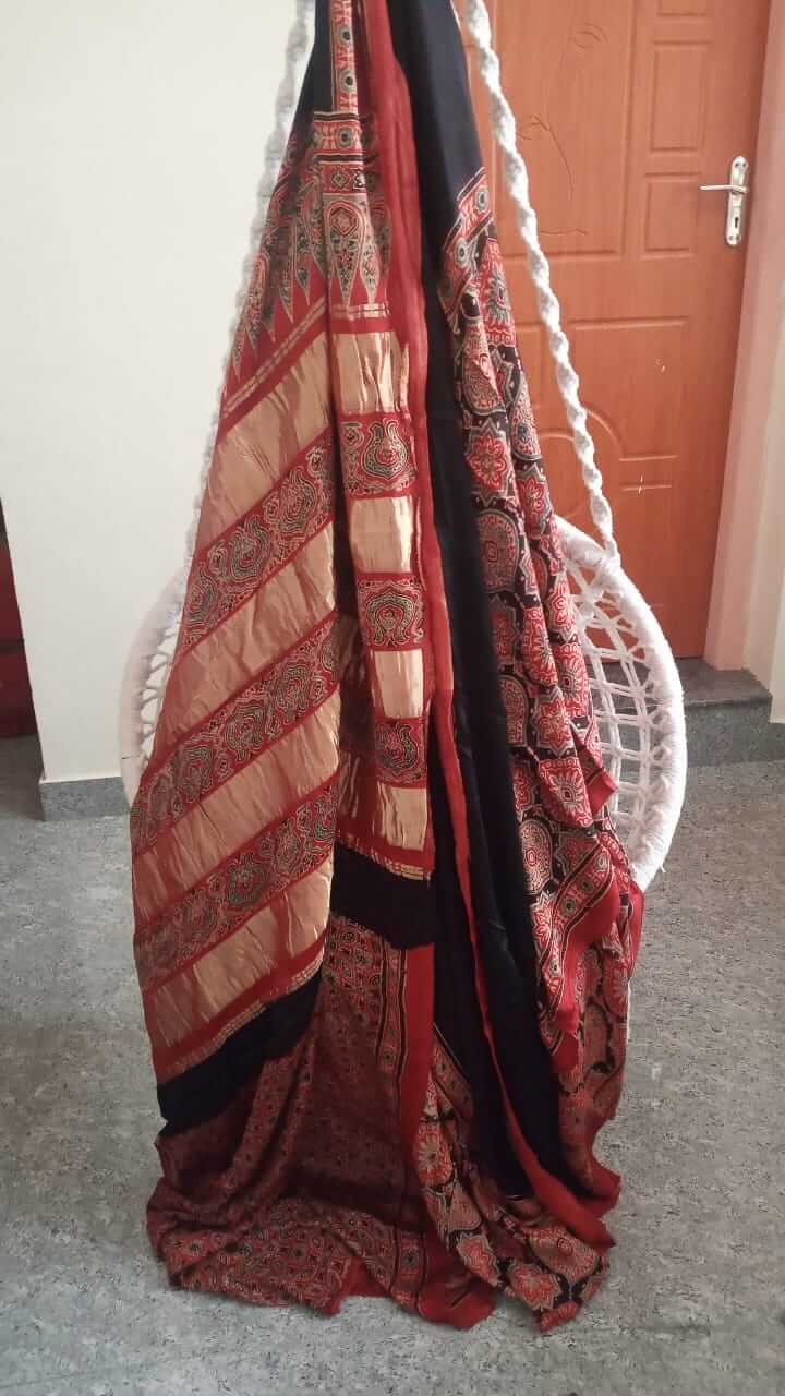 Ajrakh saree in natural dyed pure modal silk bandhini and golden jari in red with black